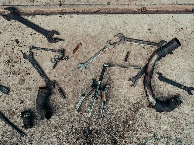 Mechanic tools and parts on a workshop floor